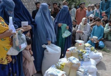 Afghan People During Collecting Aid.