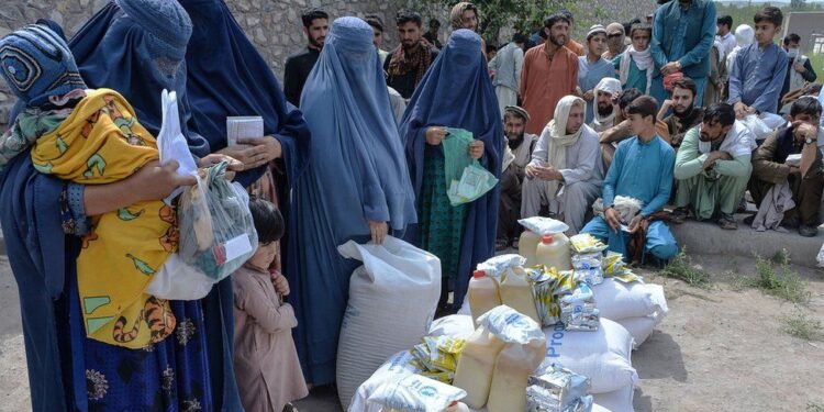 Afghan People During Collecting Aid.